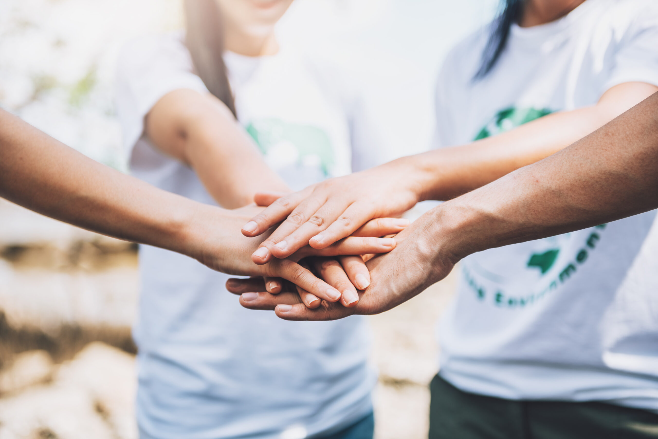 close-up-people-volunteer-teamwork-putting-finger-star-shapehands-togetherstack-handsunity-teamwork-world-environment-day